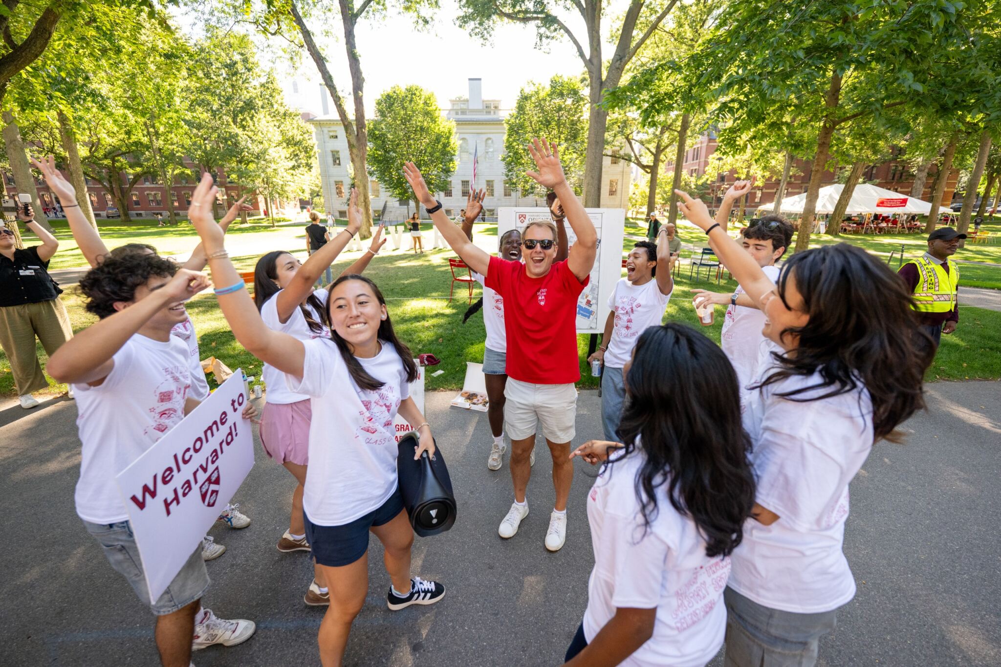 Dean Deming and Crimson Key Society students dance in Harvard Yard on Move-In Day 2025