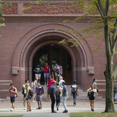 Students changing classes in the fall sumshine